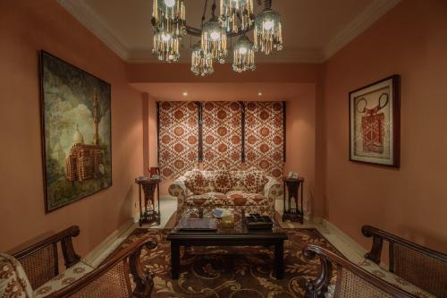 a living room with a couch and a table at Le Riad Hotel de Charme in Cairo