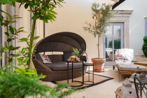 a living room with a couch and a table at Riva Marina Hvar Hotel in Hvar