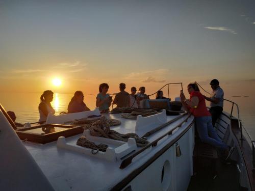 a group of people on a boat in the water at Hotel Royal in Colonia del Sacramento