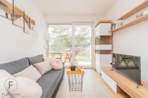 Ruang duduk di Flatbook Apartamenty - Jantar Park I