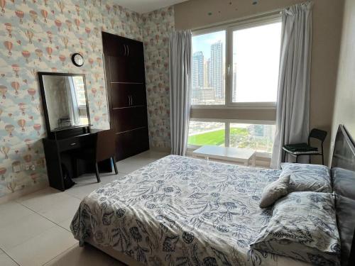Postel nebo postele na pokoji v ubytování Marina sail Tower