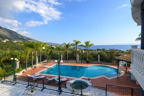 a swimming pool with a view of the ocean at Villa Aegea in Kalamata