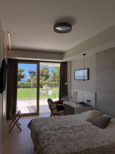 a hotel room with a bed and a desk and a window at Bel Etage Luxury Rooms - Room 1 with free Wifi in Split