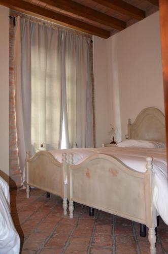 Кровать или кровати в номере Agriturismo Da Luca