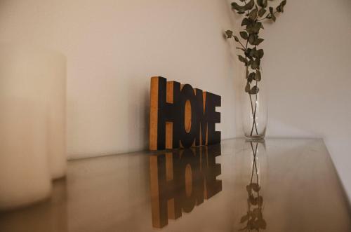 a vase sitting on a table next to a vase at Departamento INDIGO in Mendoza