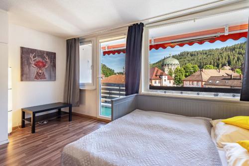 Llit o llits en una habitació de Kloster Meister Haus Apartment 11