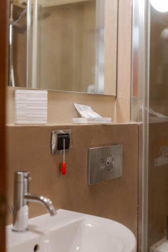 a bathroom with a sink and a mirror at Hotel Beach in Tortoreto Lido