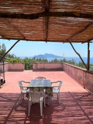 a table and chairs sitting on a patio at Farm seaview on Capri in Termini