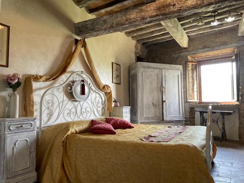 Postel nebo postele na pokoji v ubytování Agriturismo Biologico Castello Della Pieve