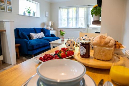 a kitchen with a table with a plate of food on it at No.51 in Lymington