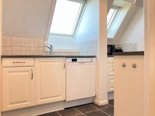a kitchen with a sink and a window at Four Bedroom Apartment In Esbjerg, Kirkegade 12 in Esbjerg