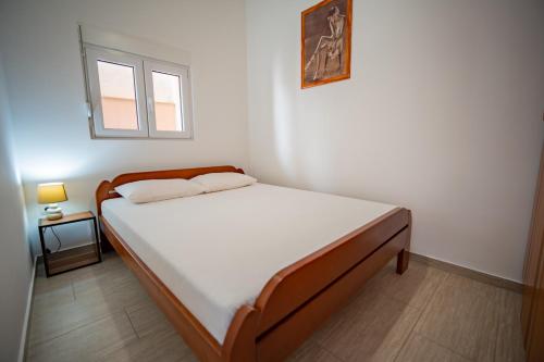 Postel nebo postele na pokoji v ubytování Apartmani Bonaca