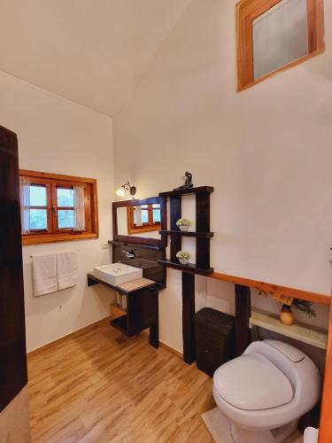 a bathroom with a toilet and a sink at Kuća za odmor Neli in Sukošan