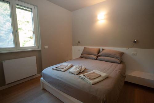 Postel nebo postele na pokoji v ubytování LookLake "Suite Two" - Plesio by LoveComo