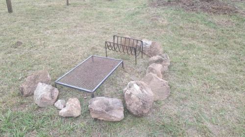 a ping pong table and rocks in a field at Serena in Villa Serrana