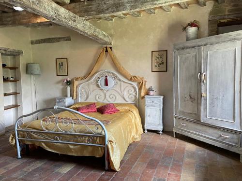 Postel nebo postele na pokoji v ubytování Agriturismo Biologico Castello Della Pieve