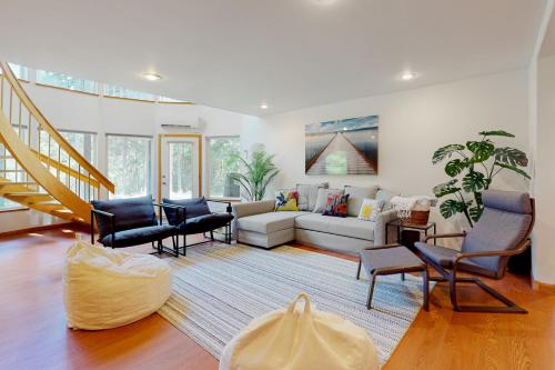 a living room with a couch and chairs at Silver Lake Splendor in Oak Harbor