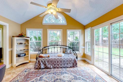 a bedroom with a bed and a ceiling fan at 1990's Classic in North Myrtle Beach