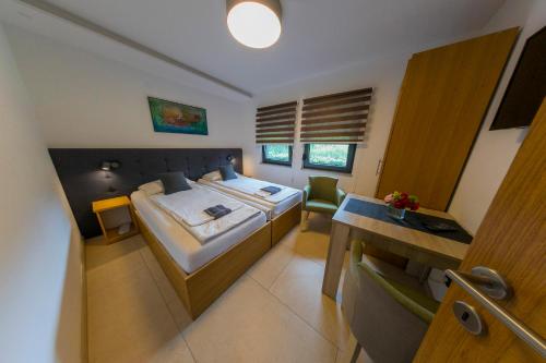 Cama o camas de una habitación en Apartments Oeneus