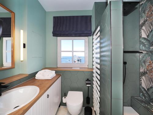 Ένα μπάνιο στο Seebrücke Heringsdorf - Appartement mit 1 Schlafzimmer und Balkon S16