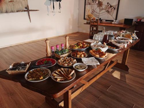 a table with a bunch of food on it at Agriturismo Desole in Monti