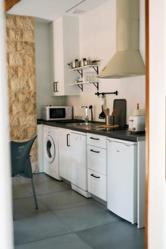 Η κουζίνα ή μικρή κουζίνα στο Apartamentos One