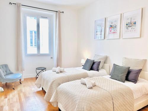 Ένα ή περισσότερα κρεβάτια σε δωμάτιο στο 2 Bedroom flat Cannes Center La Croisette Banane