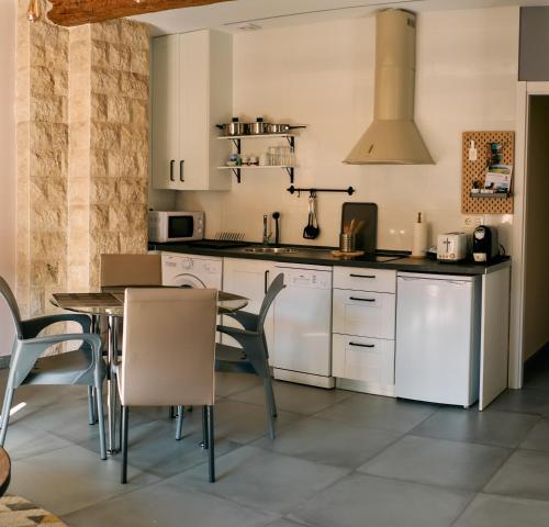 Η κουζίνα ή μικρή κουζίνα στο Apartamentos One
