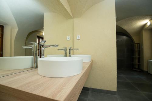 a bathroom with a sink and a tub at Women's Only Hostel - Female Only in Prague