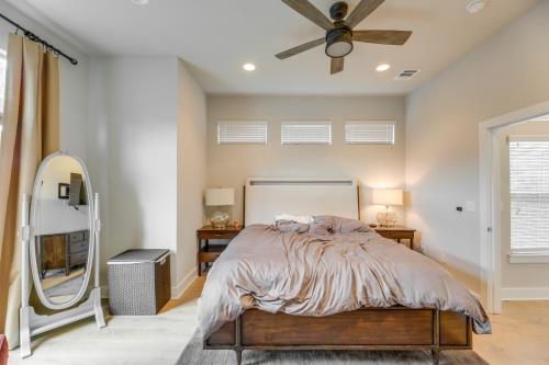 a bedroom with a bed and a mirror at Chic Austin Vacation Rental Condo Near Downtown! in Austin