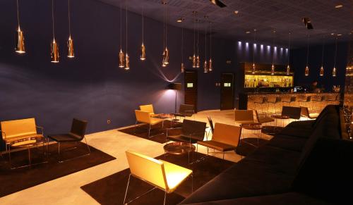 a living room with a couch and chairs and lights at Mercure Quemado Al-Hoceima Resort in Al Hoceïma