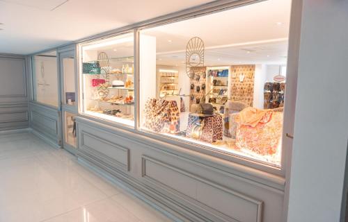 a store display window with a lot of items at Constantinos the Great Beach Hotel in Protaras