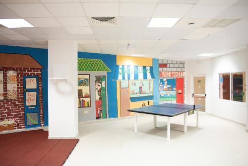 a room with a ping pong table in it at Constantinos the Great Beach Hotel in Protaras