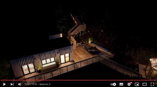 an overhead view of a house at night at Tiny house with greenhouse dining in Lower Hutt