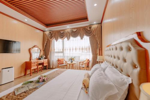 Ένα ή περισσότερα κρεβάτια σε δωμάτιο στο Tuan Nam Hotel