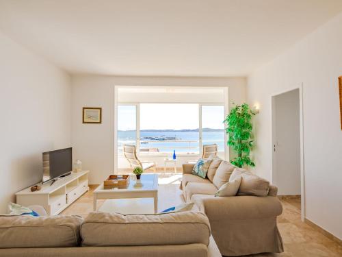 a living room with two couches and a television at Apartment Les Dauphins-1 by Interhome in Sainte-Maxime