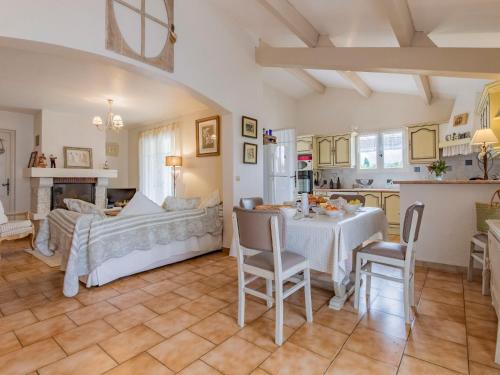 a kitchen and living room with a table and chairs at Holiday Home Les Iris by Interhome in Gargas