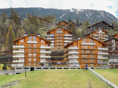 a group of apartment buildings on a mountain at Apartment Domaine des Reines D1A by Interhome in Nendaz