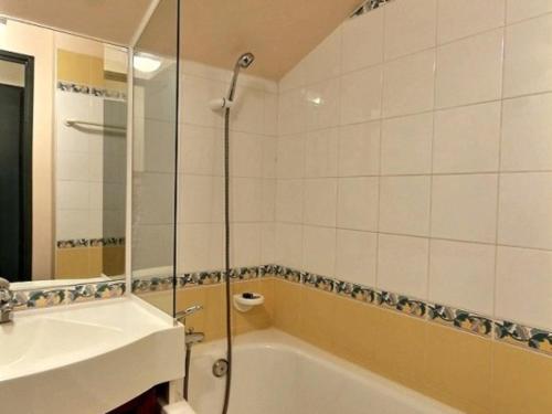 a bathroom with a tub and a sink and a shower at Appartement Plagne Soleil, 2 pièces, 5 personnes - FR-1-455-7 in Plagne Villages