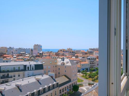 een raam met uitzicht op de stad bij Apartment L'Escale Vendée Globe - LSD300 by Interhome in Les Sables-dʼOlonne