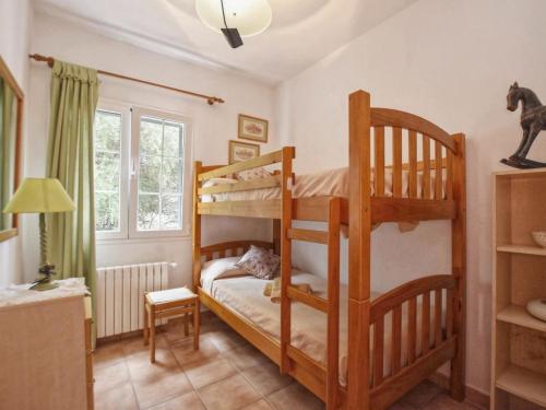 a bedroom with two bunk beds in a room at Villa Tórtolas by Interhome in Alaior