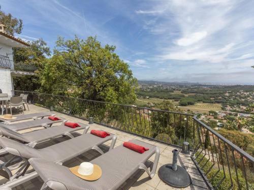 a balcony with tables and chairs and a view at Holiday Home Paris by Interhome in Calonge