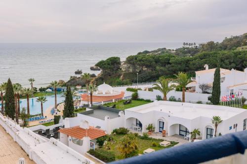 an aerial view of a house and the ocean at Grand Muthu Oura View Beach Club in Albufeira