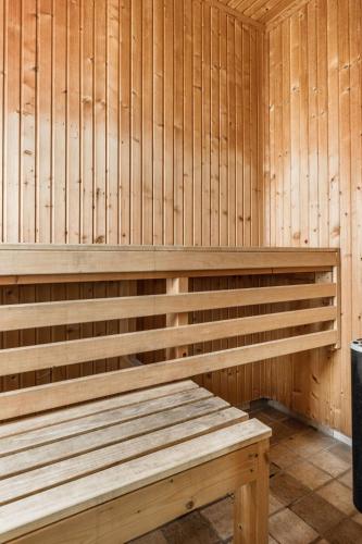 a wooden bench in a sauna at Holiday Home Erikstorp 142 by Interhome in Olofström