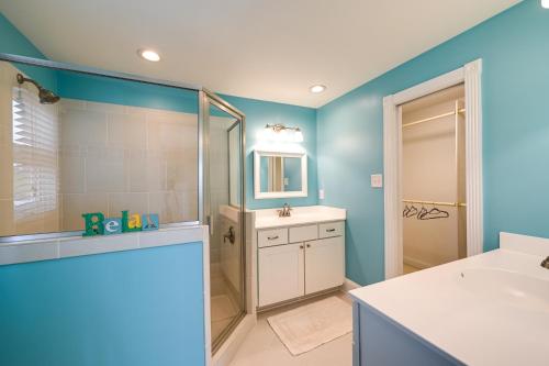 a bathroom with a shower and a sink and a tub at Chocowinity Waterfront Getaway with Boat Dock! in Chocowinity