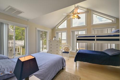 a bedroom with two beds and a ceiling fan at Chocowinity Waterfront Getaway with Boat Dock! in Chocowinity