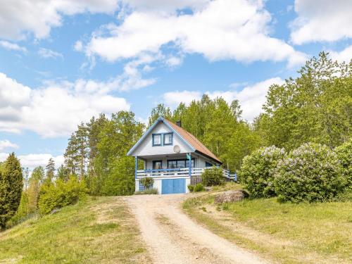 a house on a hill with a dirt road at Holiday Home Bofall by Interhome in Södra Vi