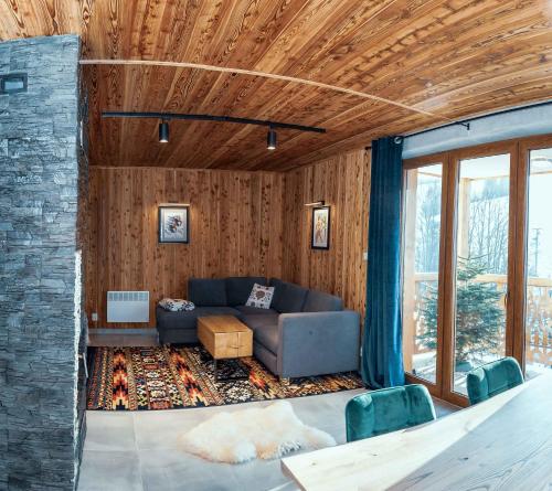 a living room with a couch and a table at Biały Miś in Jaworki
