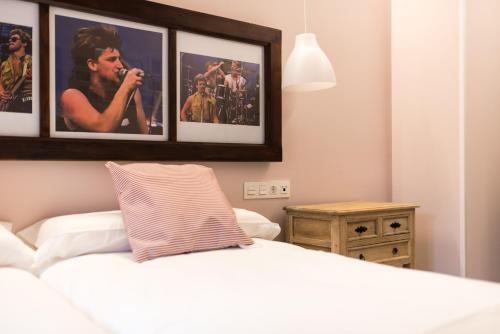 Ένα ή περισσότερα κρεβάτια σε δωμάτιο στο Apartamentos One