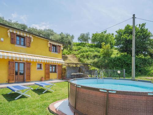 a house with a swimming pool in the yard at Holiday Home Bellavista by Interhome in Strettoia
